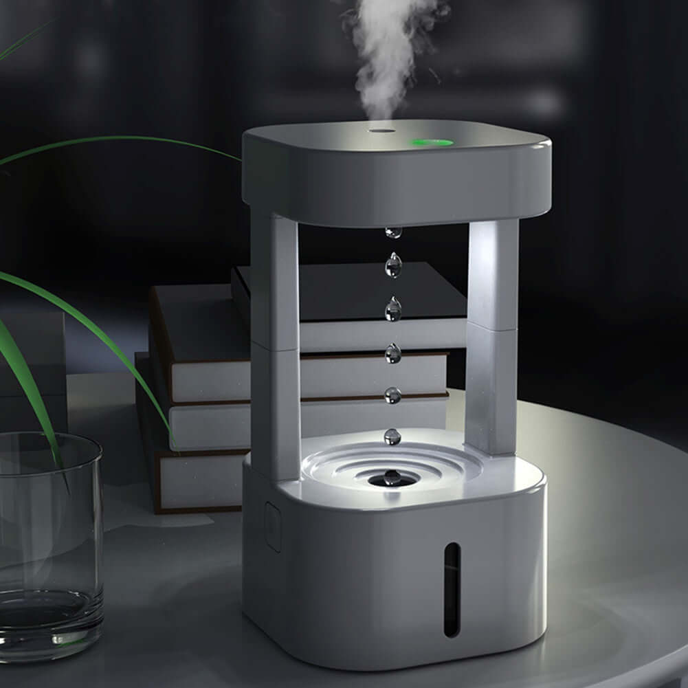 Anti Gravity Water Droplet Humidifier creating mist with floating water droplets on a stylish table setting.