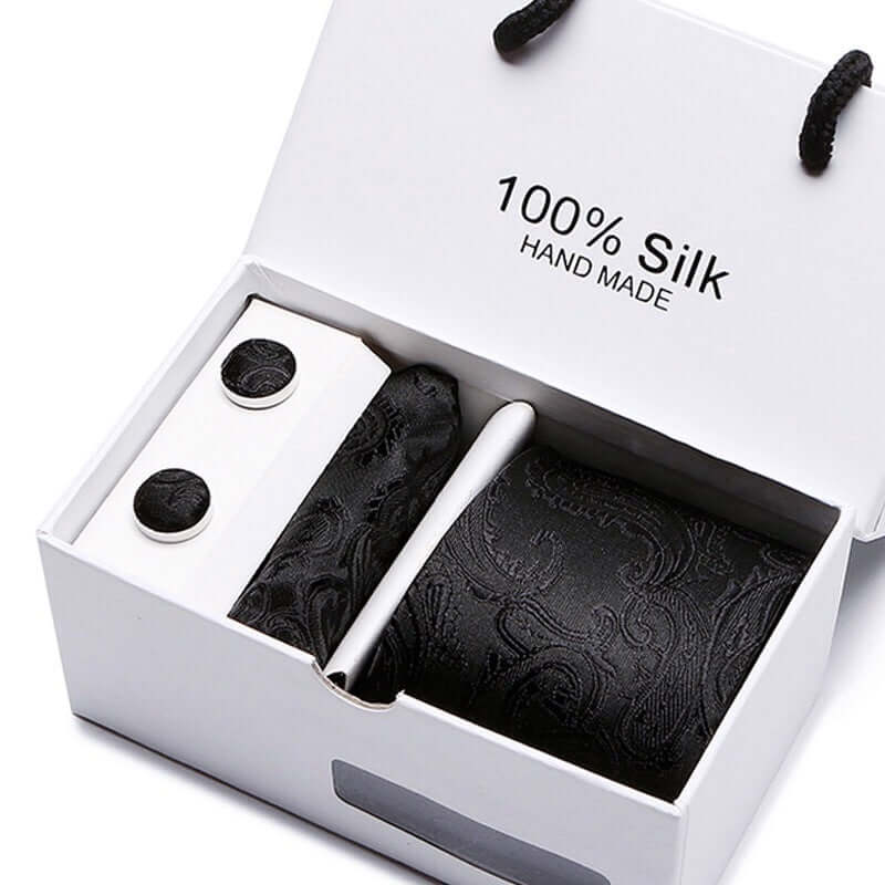 Avant-Garde Tie Set featuring 100% silk handmade tie, cufflinks, and handkerchief for the modern man.