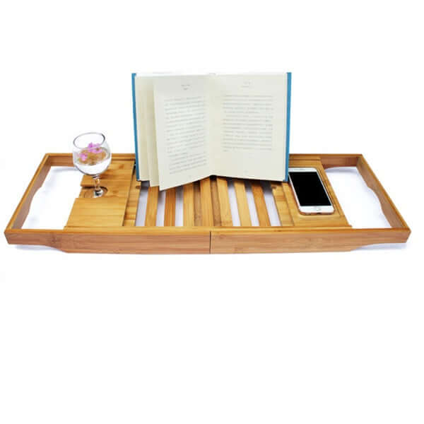 Bamboo Bathtub Caddy Tray with book, glass, and smartphone for a luxurious bath experience.
