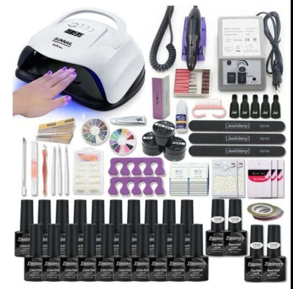 Complete manicure set including nail polish, UV lamp, buffers, and nail art tools for professional nail care and design.