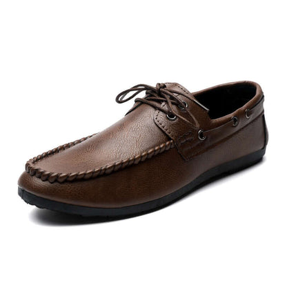 Brown faux leather loafers with a durable sole, designed for comfort and style, perfect for any casual or formal attire.