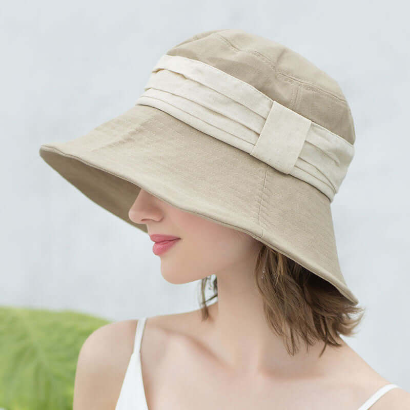 Stylish Bucket Cap Hat in beige, perfect for sun protection and summer adventures.