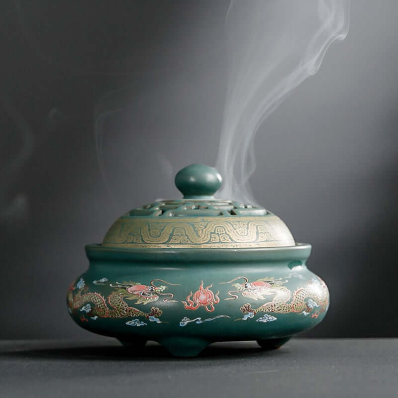 Ceramic Incense Burner with intricate dragon design and smoke wafting, perfect for enhancing tranquility in spaces.