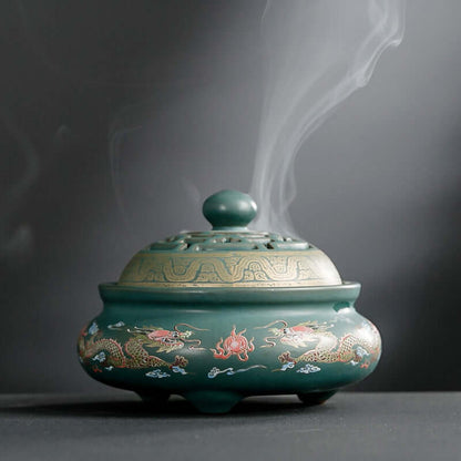 Ceramic Incense Burner with intricate dragon design and smoke wafting, perfect for enhancing tranquility in spaces.