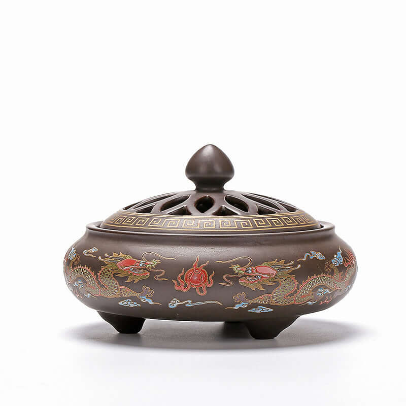 Elegant ceramic incense burner with intricate dragon designs, perfect for enhancing tranquility and style in any space.