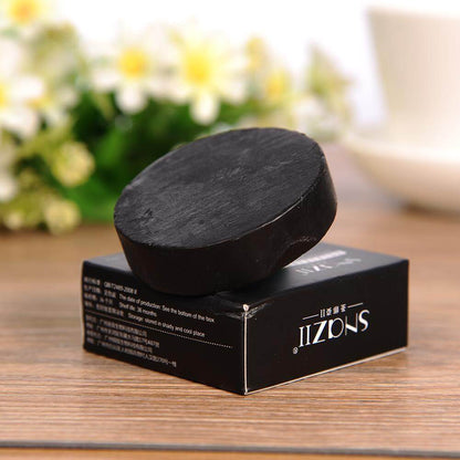 Charcoal Bamboo Soap with lavender, ideal for all skin types, displayed on a box against a floral background.