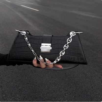 Black Baguette Handbag with stylish chain detail, made from high-quality faux leather, perfect for chic and ethical fashion.