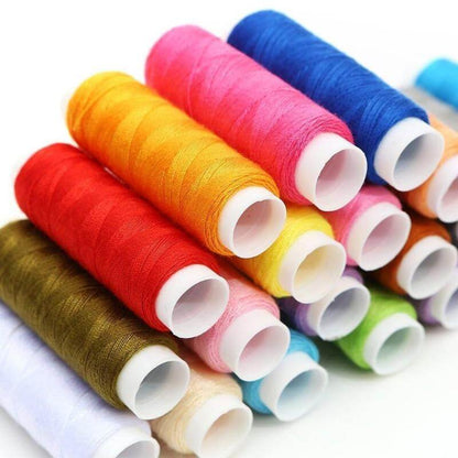 Colorful spools of thread in various hues, essential for your Home Sewing Kit projects and creative crafting.