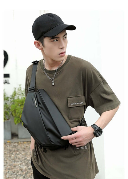 Man wearing Crossbody Multifunctional Bag in Charcoal Black for stylish everyday wear.