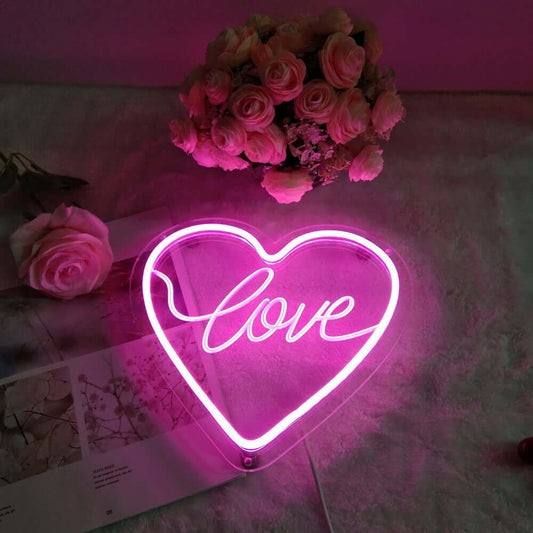 Decorative heart-shaped neon night light in vibrant pink, perfect for adding warmth and charm to any room.