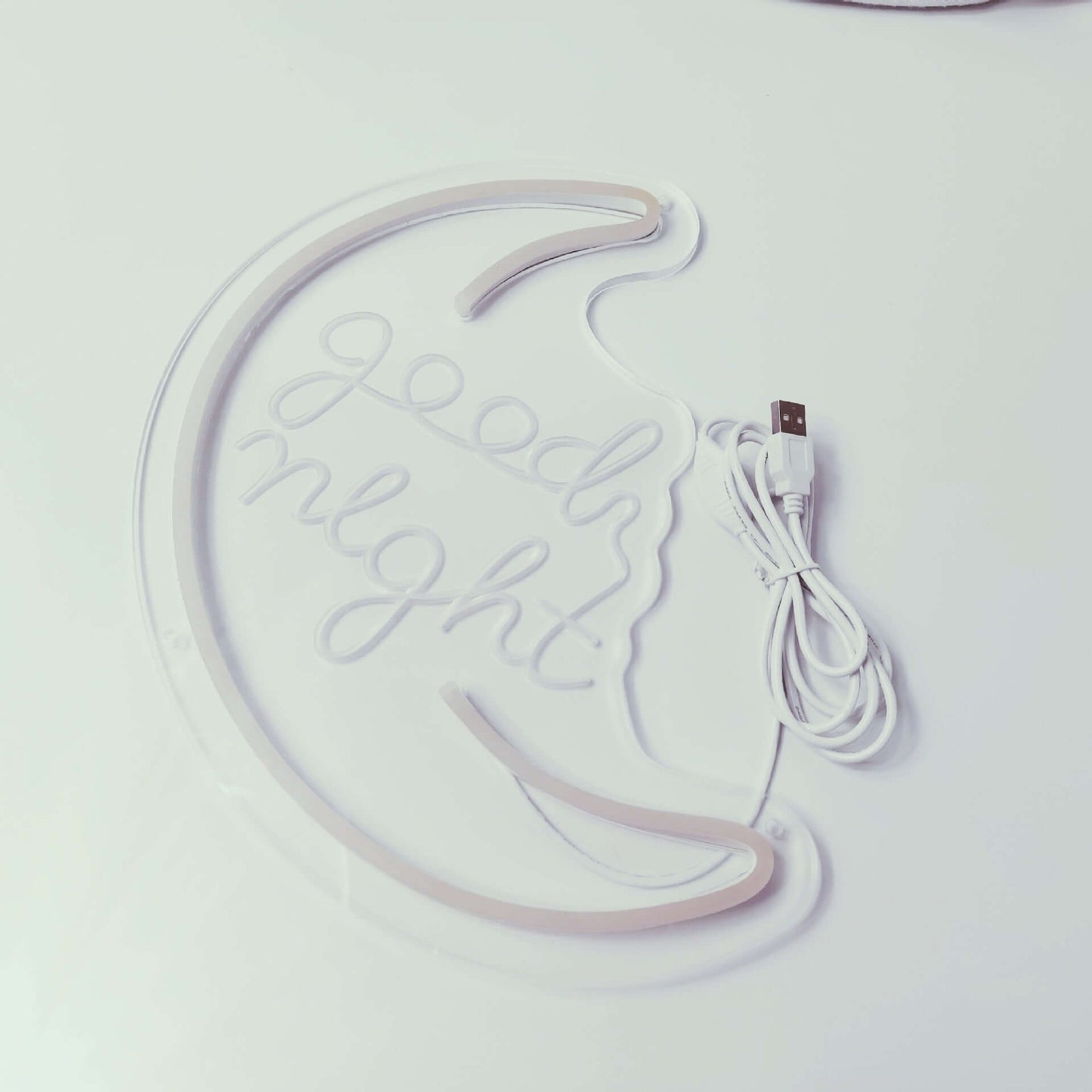Good night decorative neon light in crescent moon shape with USB cable for cozy home decor.