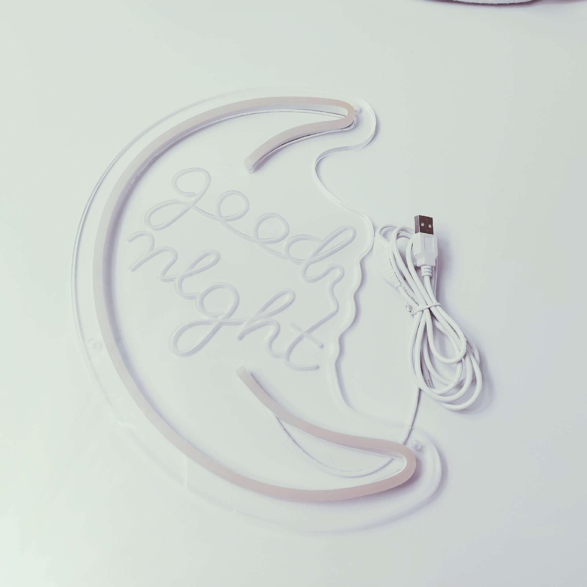 Good night decorative neon light in crescent moon shape with USB cable for cozy home decor.