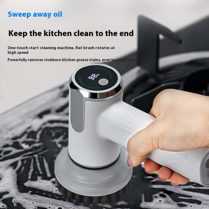 User demonstrates the Electric Cleaning Brush removing stubborn kitchen grease with ease.