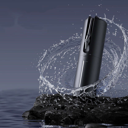 Electric Ear Wash Cleaning Tool with water splash, innovative ear hygiene device on rocky surface, ideal for maintaining ear health.