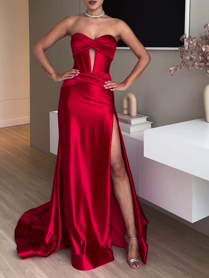 Elegant extra long evening gown in vibrant red with a sleek silhouette and thigh-high slit, perfect for formal occasions.