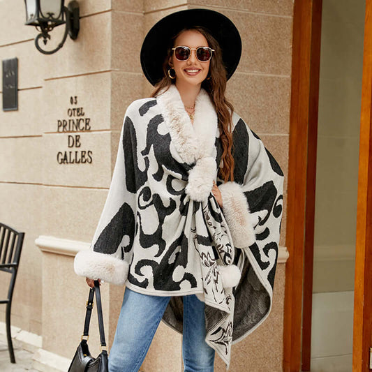 Stylish woman wearing a luxurious Faux Fur Shawl with a unique pattern outdoors, exuding elegance and warmth.