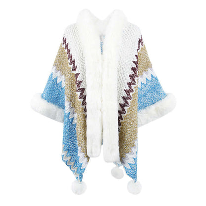 Stylish fur trimmed poncho featuring intricate patterns in blue, gold, and white, perfect for autumn and winter fashion.