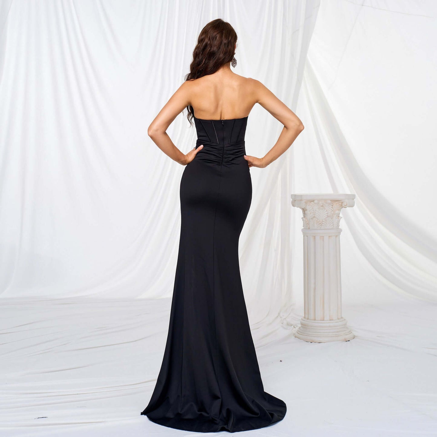 Back view of Elegant High Slit Maxi Dress in black, showcasing a flowing oversized swing skirt and high waist design for a flattering silhouette.