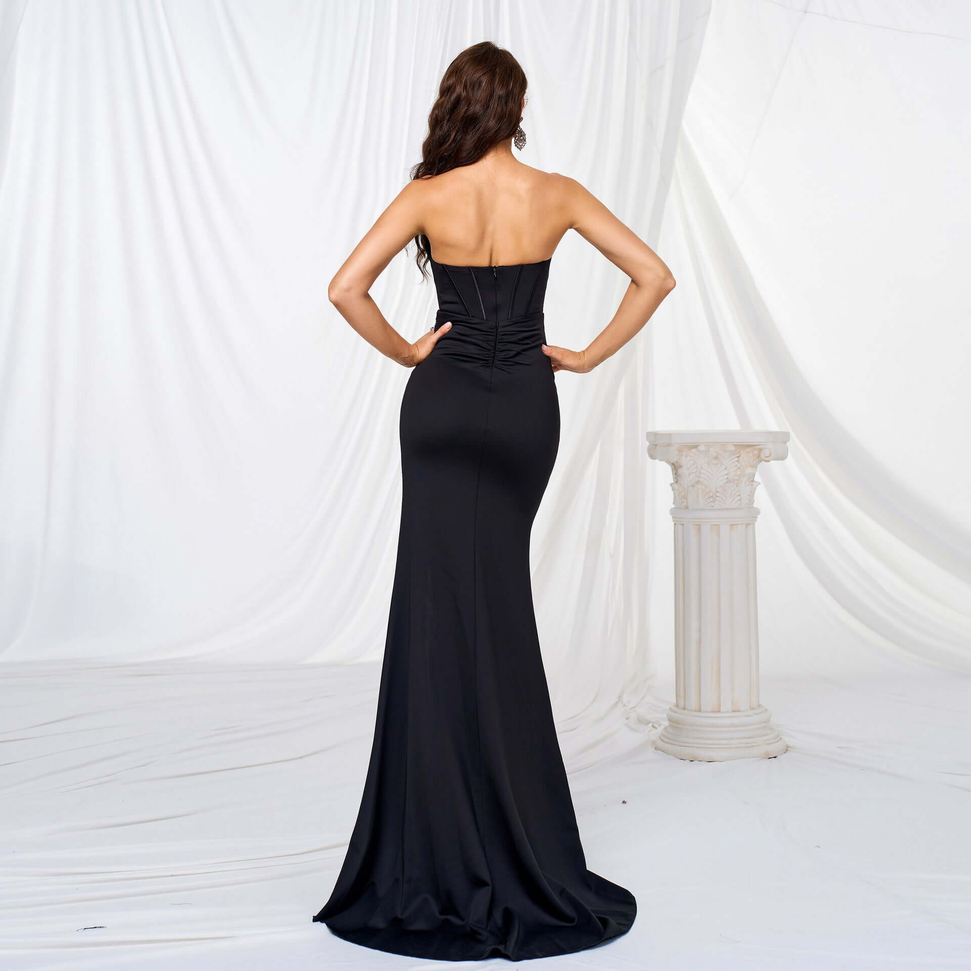 Back view of Elegant High Slit Maxi Dress in black, showcasing a flowing oversized swing skirt and high waist design for a flattering silhouette.