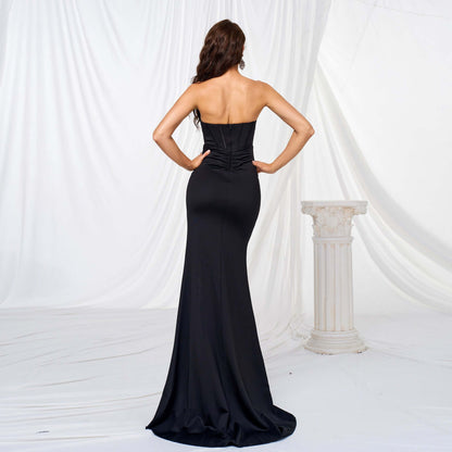 Back view of Elegant High Slit Maxi Dress in black, showcasing a flowing oversized swing skirt and high waist design for a flattering silhouette.