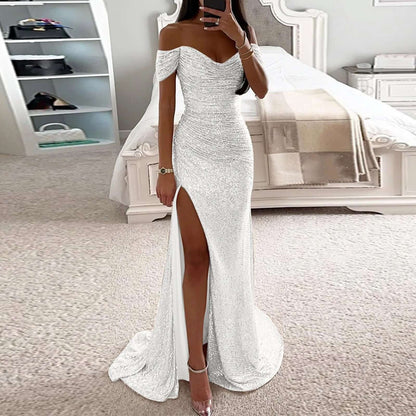 Woman wearing a white sparkling slit maxi dress, showcasing elegant style perfect for evening parties and special occasions.