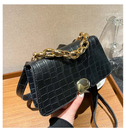 Elegant black crossbody messenger bag purse with gold chain, perfect for women on the go. Durable PU material with sleek design.