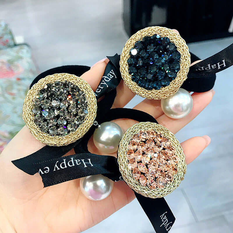 Elegant rhinestone hair ties with sparkling crystals and pearls, perfect for stylish hairdos. Ideal accessory for special occasions.