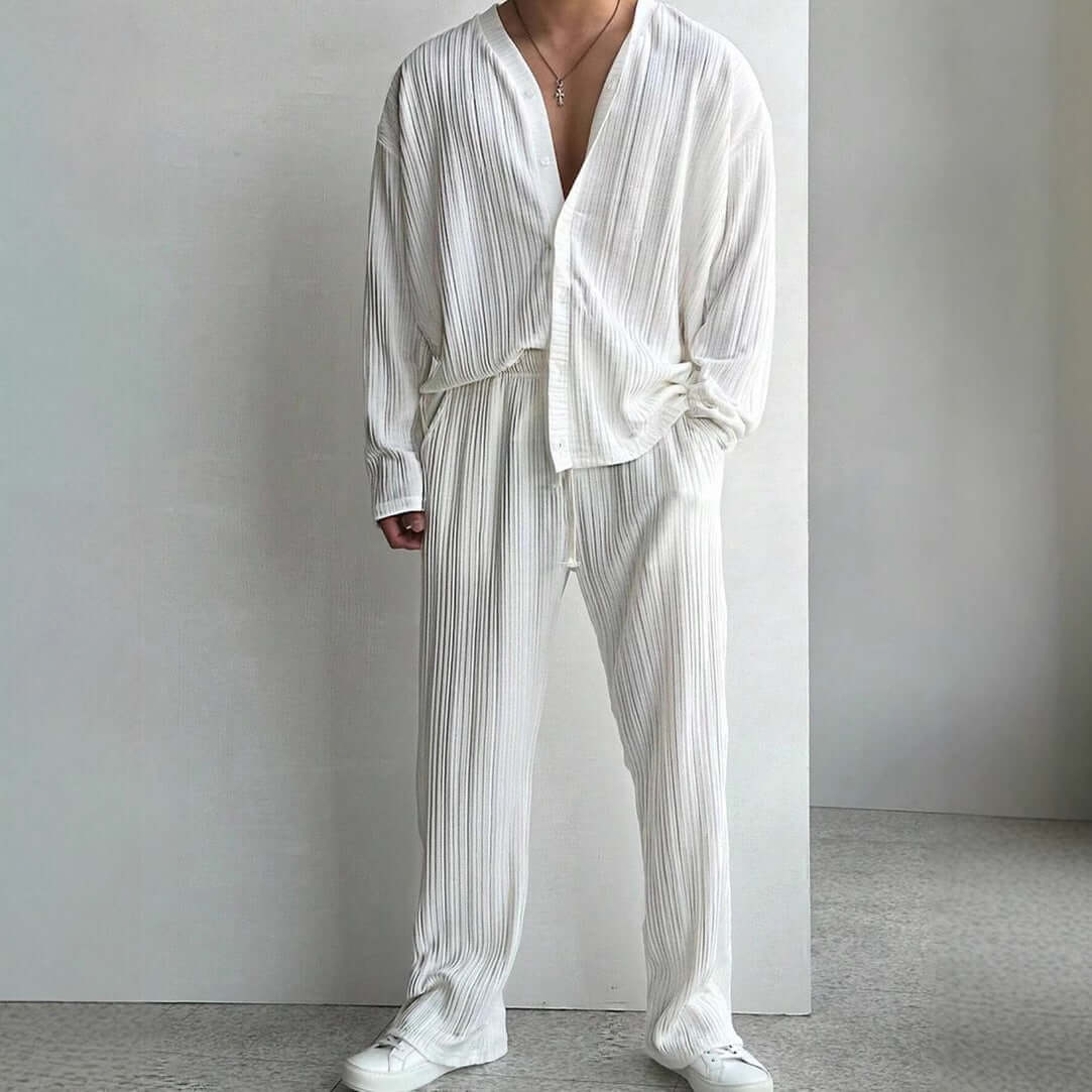 Elevate your style with a white loungewear outfit featuring a loose long-sleeve shirt and matching pants, perfect for casual comfort.