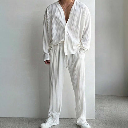 Elevate your style with a white loungewear outfit featuring a loose long-sleeve shirt and matching pants, perfect for casual comfort.