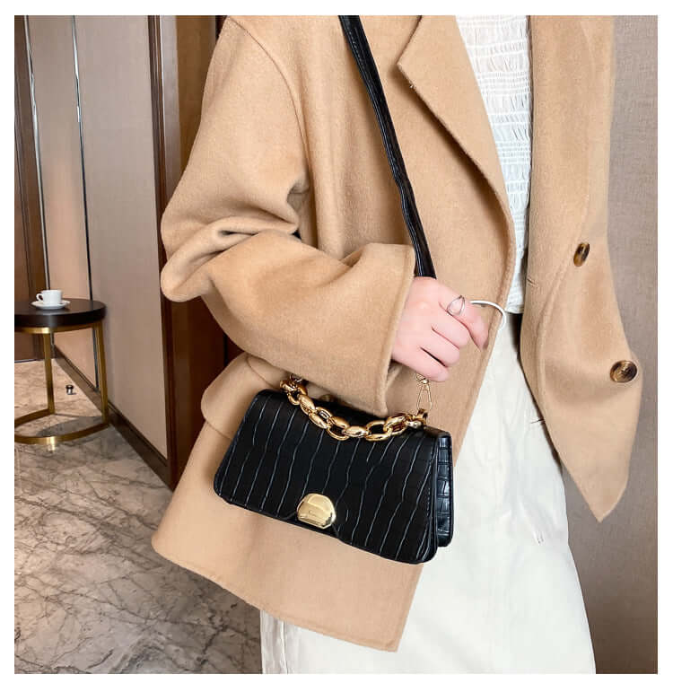 Elegant crossbody messenger bag purse in black, styled with a chic outfit, perfect for fashionable ladies seeking durability and style.