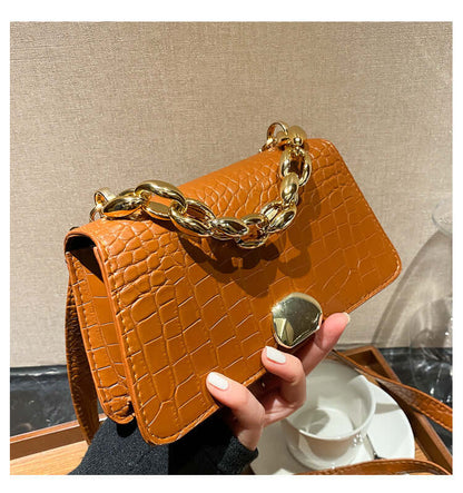Stylish crossbody messenger bag purse with crocodile pattern and gold chain, perfect for ladies, durable PU material in light brown.