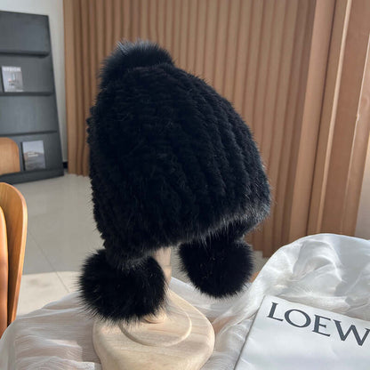 Trendy black Ear Muffs Hat featuring fluffy pom-poms, perfect for winter warmth and style.