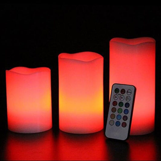 Flameless Candle Stick Candles in various sizes glowing softly in red, alongside a remote control for color options.