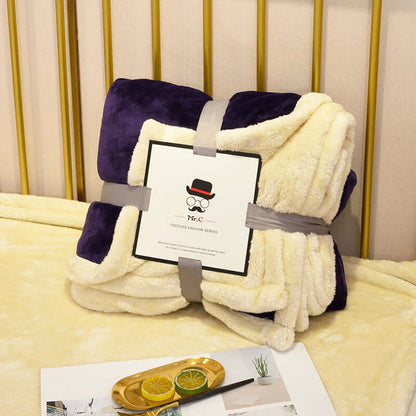 Cozy Flannel Plush Blanket in purple and cream, perfect for snuggling on the couch or bed.
