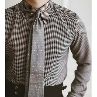 Close-up of a gentleman wearing a stylish plaid fashion shirt with a tie, perfect for elevating any man's wardrobe in taste and sophistication.