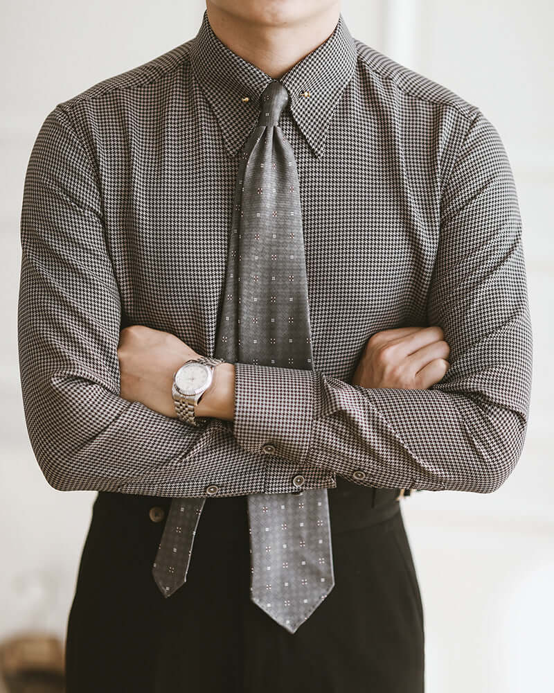 Man wearing Gentleman Plaid Fashion Shirt with tie, showcasing elegant style and sophistication.