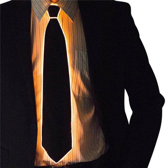 Person wearing a Glowing Necktie in a dark suit, perfect for making a stylish statement at parties and events.