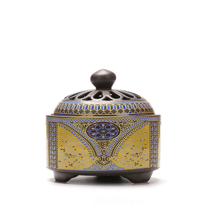Elegant ceramic incense burner with intricate blue and gold design, perfect for home decor and creating tranquility.