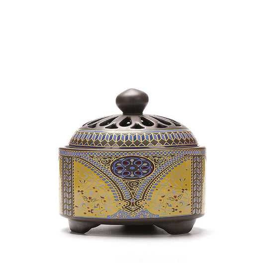 Elegant ceramic incense burner with intricate blue and gold design, perfect for home decor and creating tranquility.
