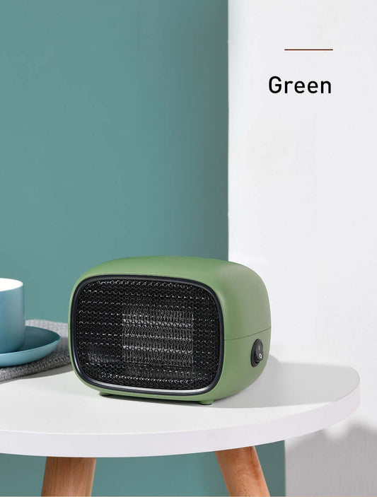 Home Depot Mini Heater in green color on a table, showcasing its compact design and modern style.