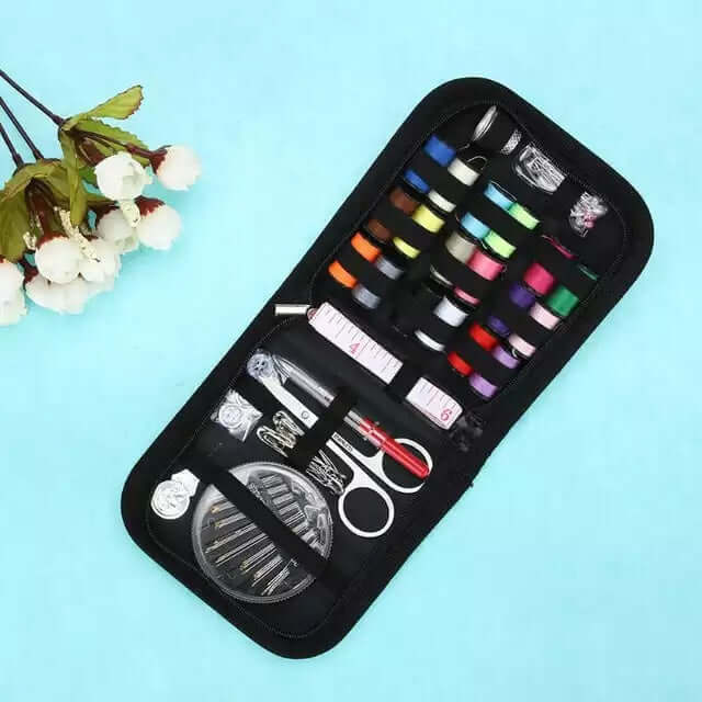 Home Sewing Kit featuring vibrant threads, scissors, and sewing essentials on a blue background.