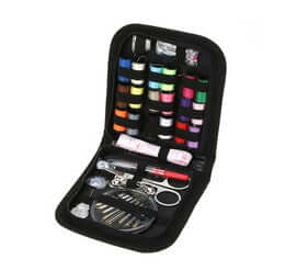 Home Sewing Kit featuring spools of thread, scissors, needles, and essential sewing tools in a compact case.