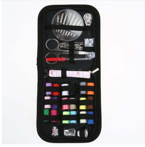 Essential Home Sewing Kit featuring threads, needles, scissors, and measuring tape for all your sewing projects.