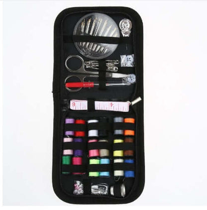 Essential Home Sewing Kit featuring threads, needles, scissors, and measuring tape for all your sewing projects.