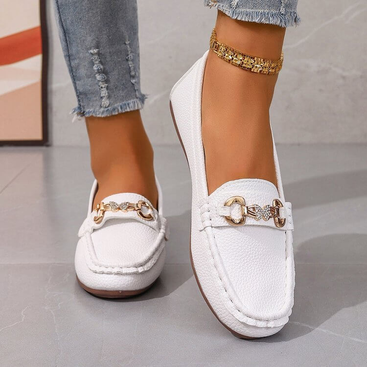 White ladies comfortable loafers in solid color design, low top, elegant footwear, perfect for casual and formal outfits.