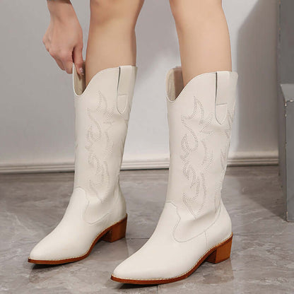White mid-calf cowboy boots for women with chunky heel, offering stability and style. Perfect classic western footwear for any occasion.