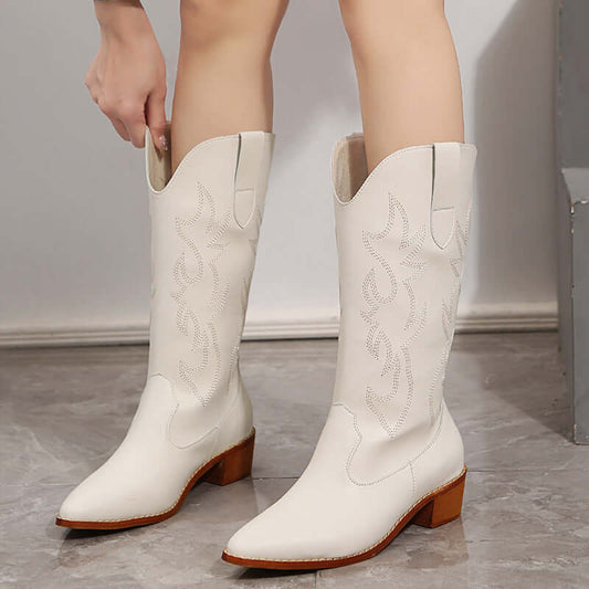White mid-calf cowboy boots for women with chunky heel, offering stability and style. Perfect classic western footwear for any occasion.