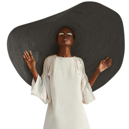 Elegant ladies straw sun hat displayed on a model, perfect for summer adventures and outdoor activities.