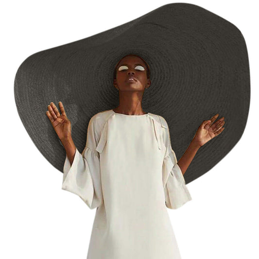 Elegant ladies straw sun hat displayed on a model, perfect for summer adventures and outdoor activities.