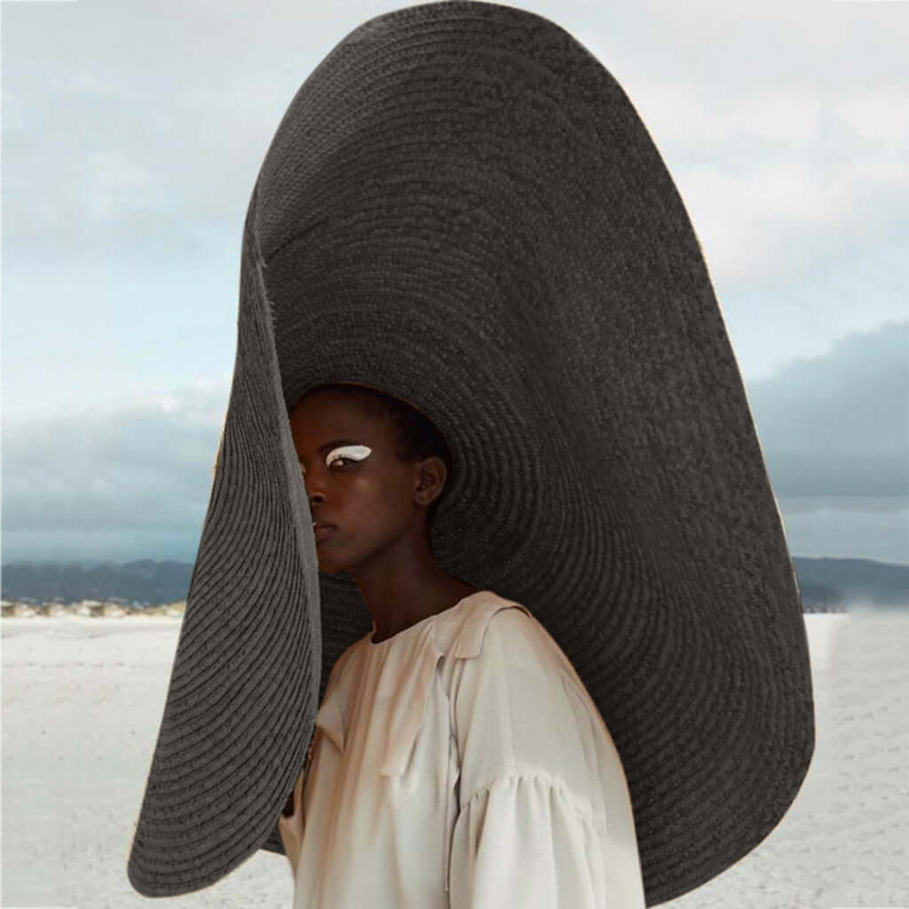 Stylish Ladies Straw Sun Hat showcased on a model, perfect for summer adventures and outdoor activities.